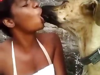 Black Woman Kissing Dog